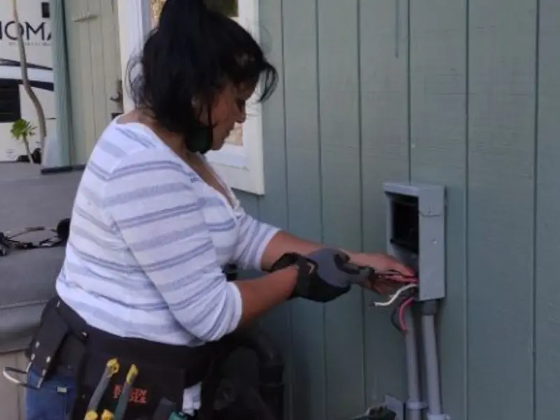 Licensed electrician wiring an exterior subpanel in Bainbridge Island